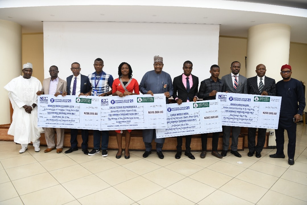 L-R: Mohammed Babajika, Director (Licensing and Authorisation), Nigerian Communications Commission (NCC); Ismail Adedigba, Deputy Director (Policy Competition and Economic Analysis); Dr Ikechukwu Adinde, Director (Public Affairs); MarcPatrick Efevuriri Efeni; Esther Gbeja; Prof Umar Garba Danbatta, NCC Executive Vice Chairman/CEO; Edosa Moses Nosa; Nasiru Abdulkarim; Engr Edoyemi Ogoh, Deputy Director (Technical Standard and Network Integrity) and Chairman of the Essay Review Committee; Yakubu Gontor, Director (Financial Services); Ephraim Nwokonneya, Director (Compliance Monitoring and Enforcement)