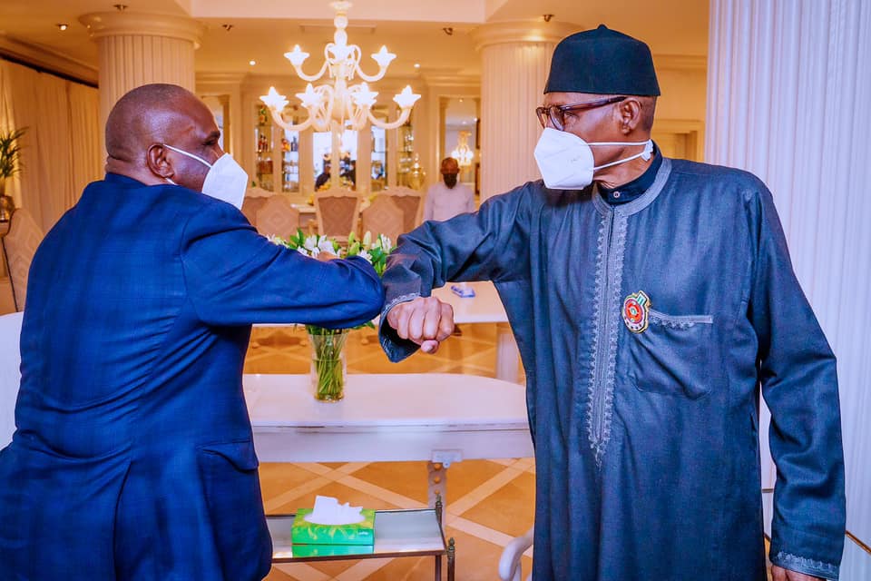 President and Chairman of the Board of Directors of Afreximbank Benedict Oramah (L), President Muhammadu Buhari (R)