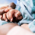 black_parent_and_child_holding_hands_closeup-732×549-thumbnail-732×549