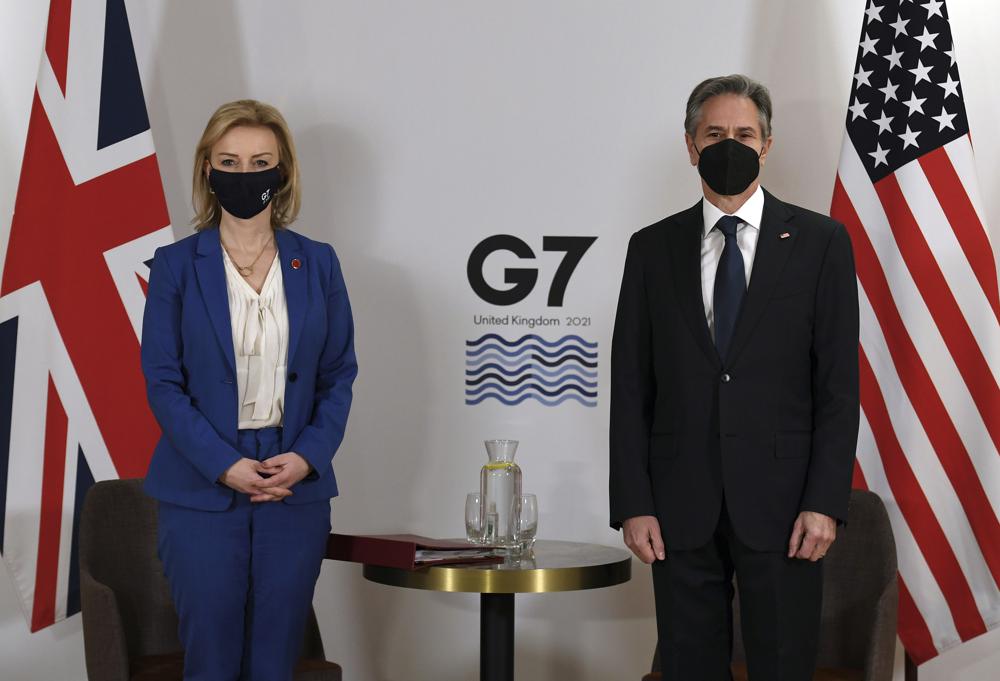 Britain’s Foreign Secretary Liz Truss, left, and US Secretary of State Antony Blinken, wearing face coverings to combat the spread of the coronavirus, pose for a photograph before a bilateral meeting ahead of the G7 foreign ministers summit in Liverpool, England, Friday, Dec. 10, 2021. – Blinken arrived in Britain for a G7 ministers’ meeting before visiting Indonesia, Malaysia and Thailand. (Olivier Douliery/Pool Photo via AP)