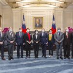 In this photo released by the Taiwan Presidential Office, Taiwan president Tsai Ing-wen, center left, poses for photos with Francois de Rugy, the head of the Taiwan Friendship group in the National Assembly, center right, and other French lawmakers during a visit at the Presidential Office in Taipei, Taiwan, Dec. 16, 2021. Rugy is who is leading a team of French lawmakers from the French National Assembly on a five-day visit to Taiwan. (Taiwan Presidential Office via AP)