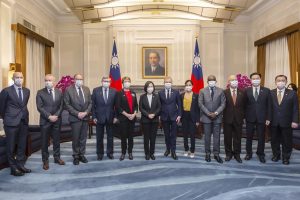 In this photo released by the Taiwan Presidential Office, Taiwan president Tsai Ing-wen, center left, poses for photos with Francois de Rugy, the head of the Taiwan Friendship group in the National Assembly, center right, and other French lawmakers during a visit at the Presidential Office in Taipei, Taiwan, Dec. 16, 2021. Rugy is who is leading a team of French lawmakers from the French National Assembly on a five-day visit to Taiwan. (Taiwan Presidential Office via AP)