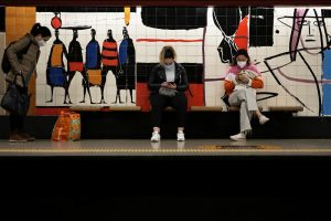 People wearing face masks to help curbing COVID-19 virus spread wait for a train at a subway station in Lisbon, Tuesday, Dec. 7, 2021. Despite having one of the highest vaccination rates in Europe, with 86.6% of its 10.3 million people inoculated, Portugal is scaling up its pandemic response amid the emergence of the omicron variant. (AP Photo/Armando Franca)