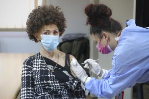 A woman is administered a COVID-19 vaccine at a center on the outskirts of Sarajevo, Bosnia, Sunday, Dec. 12, 2021. Some vaccine late-takers in Bosnia say they recently decided to finally embrace Covid-19 shots after numerous European countries started tightening their anti-virus rules, including by requiring proof of vaccination from foreign visitors before letting them in and giving them access to public venues within their borders. (AP Photo)