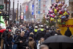 Despite rainy weather, Duesseldorf’s city centre is well frequented despite the Corona rules for retailers, shortly before Christmas in Duesseldorf, Germany, Saturday, Dec. 18, 2021. (Malte Krudewig/dpa via AP)