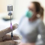 FILE – A nurse prepares a dose of Pfizer COVID-19 vaccine to be injected at the Andras Josa Teaching Hospital in Nyiregyhaza, Hungary, Jan. 24, 2021. As coronavirus infections and deaths soar in Hungary, the country’s journalists and public health professionals are demanding more detailed data on the outbreak from the government, with some experts saying that greater transparency might boost lagging vaccination rates. (Attila Balazs/MTI via AP, File)