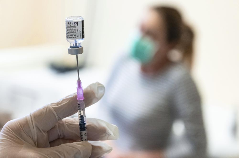 FILE – A nurse prepares a dose of Pfizer COVID-19 vaccine to be injected at the Andras Josa Teaching Hospital in Nyiregyhaza, Hungary, Jan. 24, 2021. As coronavirus infections and deaths soar in Hungary, the country’s journalists and public health professionals are demanding more detailed data on the outbreak from the government, with some experts saying that greater transparency might boost lagging vaccination rates. (Attila Balazs/MTI via AP, File)