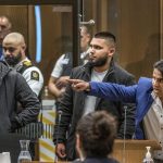 FILE – Abdul Aziz, right, gestures as he gives his victim impact statement during the sentencing hearing for Australian Brenton Harrison Tarrant at the Christchurch High Court after Tarrant pleaded guilty to 51 counts of murder, 40 counts of attempted murder and one count of terrorism in Christchurch, New Zealand on Aug. 26, 2020. Aziz is one of two worshippers who at different times charged toward a gunman to try and stop his massacre were on Thursday, Dec. 16, 2021 each awarded New Zealand’s highest honor for civilian bravery. (John Kirk-Anderson/Pool Photo via AP, File)