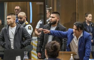 FILE – Abdul Aziz, right, gestures as he gives his victim impact statement during the sentencing hearing for Australian Brenton Harrison Tarrant at the Christchurch High Court after Tarrant pleaded guilty to 51 counts of murder, 40 counts of attempted murder and one count of terrorism in Christchurch, New Zealand on Aug. 26, 2020. Aziz is one of two worshippers who at different times charged toward a gunman to try and stop his massacre were on Thursday, Dec. 16, 2021 each awarded New Zealand’s highest honor for civilian bravery. (John Kirk-Anderson/Pool Photo via AP, File)