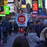People wait in a long line to get tested for COVID-19 in Times Square, New York, Monday, Dec. 20, 2021. Just a couple of weeks ago, New York City seemed like a relative bright spot in the U.S. coronavirus struggle. Now it’s a hot spot, confronting a dizzying spike in cases, a scramble for testing, a quandary over a major event and an exhausting sense of déjà vu. (AP Photo/Seth Wenig)
