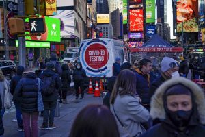 People wait in a long line to get tested for COVID-19 in Times Square, New York, Monday, Dec. 20, 2021. Just a couple of weeks ago, New York City seemed like a relative bright spot in the U.S. coronavirus struggle. Now it’s a hot spot, confronting a dizzying spike in cases, a scramble for testing, a quandary over a major event and an exhausting sense of déjà vu. (AP Photo/Seth Wenig)