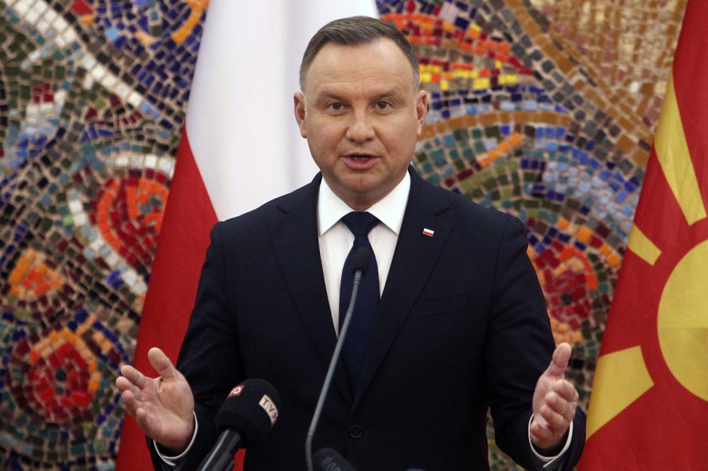 FILE – Poland’s President Andrzej Duda talks for the media during a news conference with North Macedonia’s President Stevo Pendarovski at the presidential office in Skopje, North Macedonia, on Friday, Nov. 19, 2021. Poland’s president on Monday, Dec. 27, 2021 says he has decided to veto a media bill that would have forced U.S. company Discovery to give up controlling share in TVN, a Polish TV network. President Andrzej Duda noted that the bill was unpopular with many Poles and would have dealt a blow to Poland’s reputation as a place to do business. (AP Photo/Boris Grdanoski, File)