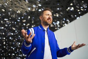 French DJ David Guetta reacts during an interview with a journalist at the Louvre Abu Dhabi in Abu Dhabi, United Arab Emirates, Thursday, Dec. 16, 2021. Guetta, who has a special show airing New Year’s Eve that he shot at the Louvre Abu Dhabi, defended his participation in Saudi music festivals in an interview with The Associated Press amid criticism by human rights activists of performers entertaining in the kingdom. (AP Photo/Jon Gambrell)