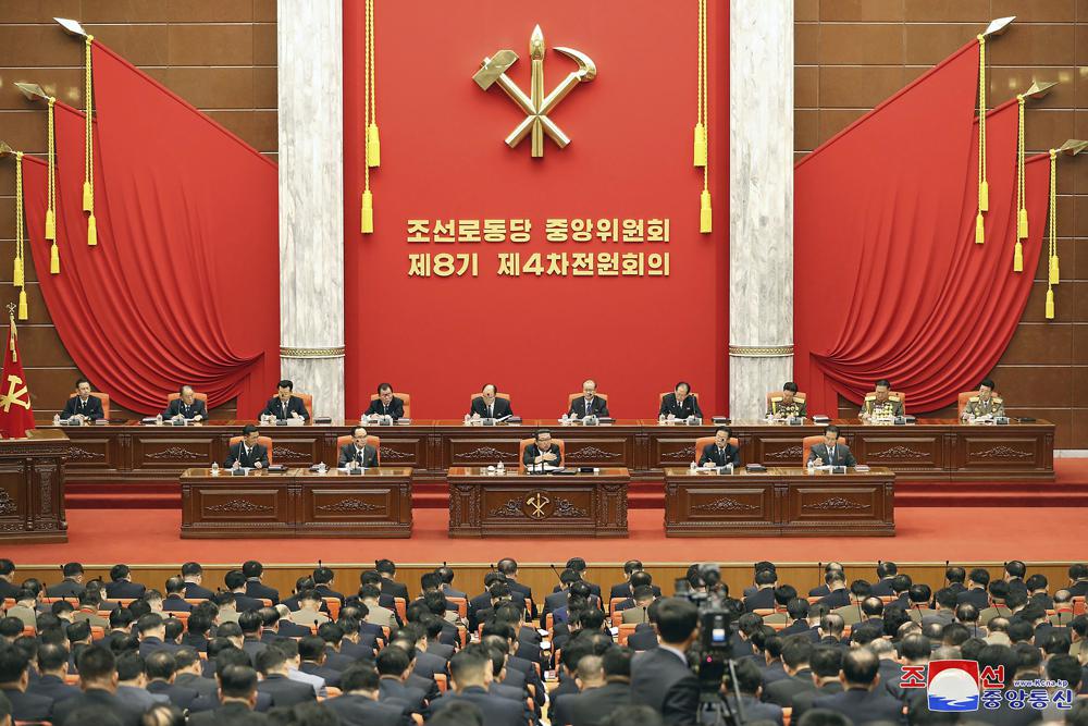 In this photo provided by the North Korean government, North Korean leader Kim Jong Un, center, attends a meeting of the Central Committee of the ruling Workers’ Party in Pyongyang, North Korea on Monday, Dec. 27, 2021. Independent journalists were not given access to cover the event depicted in this image distributed by the North Korean government. The content of this image is as provided and cannot be independently verified. Korean language watermark on image as provided by source reads: “KCNA” which is the abbreviation for Korean Central News Agency. (Korean Central News Agency/Korea News Service via AP)