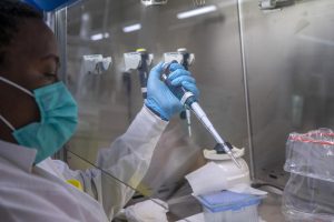 Puseletso Lesofi prepares to sequence COVID-19 omicron samples at the Ndlovu Research Center in Elandsdoorn, South Africa, Dec. 8, 2021. Health experts still don’t know if omicron is causing milder COVID-19 but some more hints are emerging with doctors in South Africa saying their patients aren’t getting as sick with omicron, compared to the delta variant. (AP Photo/Jerome Delay, File)