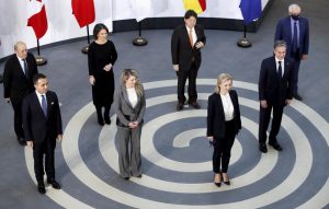 G7 foreign ministers, pose in a socially distanced manner for a group photo at the Museum of Liverpool, Liverpool, England, Saturday Dec. 11, 2021. Foreign Secretary Liz Truss is hosting U.S. Secretary of State Antony Blinken and other Group of Seven counterparts for weekend talks in the northwest England port city of Liverpool as the wealthy nations club faces growing tensions with Russia, China and Iran. From left, France’s Minister for Europe and Foreign Affairs Jean-Yves Le Drian, Italy’s Foreign Minister Luigi Di Maio, Germany’s Foreign Minister Annalena Baerbock, Canada’s Minister of Foreign Affairs Melanie Joly, Japan’s Foreign Minister Yoshimasa Hayashi, Britain’s Foreign Secretary Liz Truss, US Secretary of State Antony Blinken and European High Representative of the Union for Foreign Affairs Josep Borrell. (Phil Noble/Pool via AP)