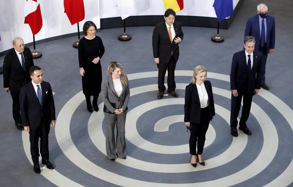 G7 foreign ministers, pose in a socially distanced manner for a group photo at the Museum of Liverpool, Liverpool, England, Saturday Dec. 11, 2021. Foreign Secretary Liz Truss is hosting U.S. Secretary of State Antony Blinken and other Group of Seven counterparts for weekend talks in the northwest England port city of Liverpool as the wealthy nations club faces growing tensions with Russia, China and Iran. From left, France’s Minister for Europe and Foreign Affairs Jean-Yves Le Drian, Italy’s Foreign Minister Luigi Di Maio, Germany’s Foreign Minister Annalena Baerbock, Canada’s Minister of Foreign Affairs Melanie Joly, Japan’s Foreign Minister Yoshimasa Hayashi, Britain’s Foreign Secretary Liz Truss, US Secretary of State Antony Blinken and European High Representative of the Union for Foreign Affairs Josep Borrell. (Phil Noble/Pool via AP)