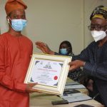 Femi Falana handing over the award to one of the awardees