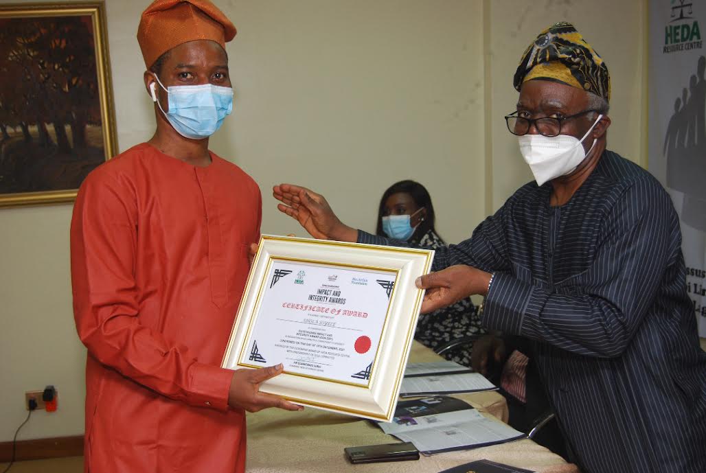 Femi Falana handing over the award to one of the awardees