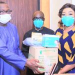 Sen Ndoma Egbe handing over some of the items to the Commissioner for Health, Dr Beta Edu, in Calabar