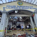 In this photo provided by the Office of the Vice President, Philippine Vice President Leni Robredo, center, inspects damages due to Typhoon Rai at Dinagat islands, southern Philippines on Sunday Dec. 19, 2021. The death toll continues to rise following the strongest typhoon to batter the Philippines this year, with several central towns and provinces still grappling with downed communications and power outages and pleading for food and water, officials said Monday. (Office of the Vice President via AP)