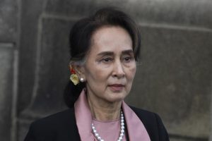 FILE – Myanmar’s leader Aung San Suu Kyi leaves the International Court of Justice after the first day of three days of hearings in The Hague, Netherlands on Dec. 10, 2019. A court in military-ruled Myanmar has postponed a verdict on Monday, Dec. 27, 2021 in a case against ousted leader Aung San Suu Kyi in which she is charged with importing and possessing walkie-talkies without following official procedures, a legal official familiar with the case said. (AP Photo/Peter Dejong, File)