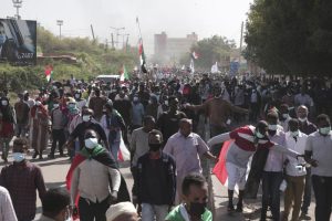 People take part in a protest against the October military takeover and a subsequent deal that reinstated Prime Minister Abdalla Hamdok but sidelined the movement in Khartoum, Sudan, Sunday, Dec. 19, 2021. (AP Photo/Marwan Ali)
