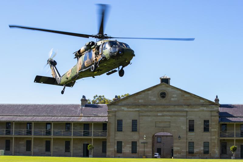 In this photo released by the Australian Department of Defence, an Australian Army S-70A-9 Black Hawk helicopter lands at Victoria Barracks in Sydney, Australia, Friday, Dec. 10, 2021. Australia’s military said Friday, Dec. 10, 2021, it plans to ditch its fleet of European-designed Taipan helicopters and instead buy U.S. Black Hawks and Seahawks choppers because the American machines are more reliable. (Cpl. Dustin Anderson/Department of Defence via AP)