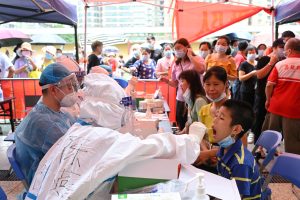 FILE PHOTO: Mass testing for the coronavirus disease (COVID-19) at a stadium in Guangzhou