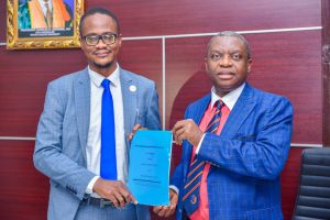 UNIZIK VC, Prof. Charles Esimone (R) and the CEO of Bionomics Nigeria Ltd, Mr Onyedika Ugochukwu after signing an MoU TO mount CCTV cameras in the university