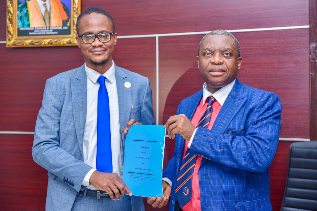 UNIZIK VC, Prof. Charles Esimone (R) and the CEO of Bionomics Nigeria Ltd, Mr Onyedika Ugochukwu after signing an MoU TO mount CCTV cameras in the university
