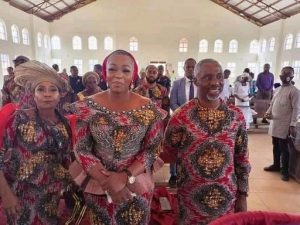 Uche Nwosu with his wife and mother in church before his arrest on Sunday