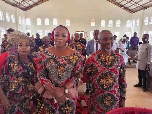 Uche Nwosu with his wife and mother in church before his arrest on Sunday