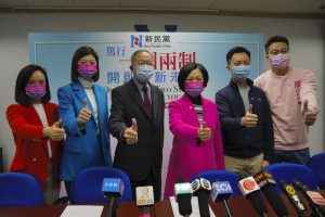 Members of New People’s Party, from left, Judy Chan, Eunice Yung, Lai Tung-kwok, Regina Ip, Dominic Lee and Marcus Liu pose for a photograph during a press conference after winning the legislative election in Hong Kong, Monday, Dec. 20, 2021. Pro-Beijing candidates dominated Hong Kong’s legislative elections, beating out moderates and independents in the city’s first public poll after Beijing passed a resolution to amend the city’s election laws. (AP Photo/Kin Cheung)
