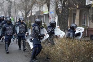 Riot police walk to block demonstrators during a protest in Almaty, Kazakhstan, Wednesday, Jan. 5, 2022. Demonstrators denouncing the doubling of prices for liquefied gas have clashed with police in Kazakhstan’s largest city and held protests in about a dozen other cities in the country. (AP Photo/Vladimir Tretyakov)