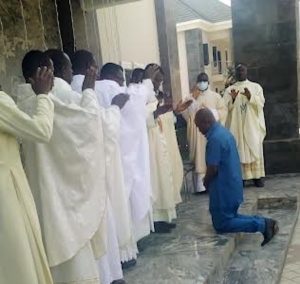 Reverend Fathers praying for Chief Onwugbenu