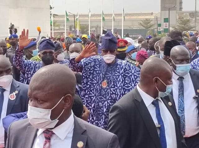 Buhari-and-Abiodun-acknowledges-cheers-