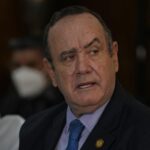 FILE – Guatemalan President Alejandro Giammattei meets U.S. Secretary of Homeland Security Alejandro Mayorkas at the Presidential House offices in Guatemala City, Tuesday, July 6, 2021. Guatemala has hired on Jan. 13, 2022, for $900,000 a major supporter of former President Donald Trump to seek influence with U.S. officials in an unusual lobbying contract paid for by its ally Taiwan, foreign lobby records show. (AP Photo/Moises Castillo, File)