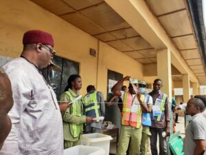 National Commissioner Barr Festus Okoye, observing the sorting and counting of  ballots at Okuku ward, Polling Unit 4, Ogoja