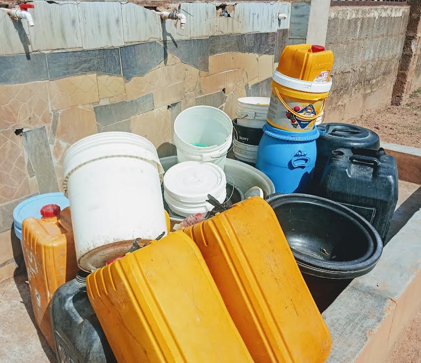 Residents of Ungwan Baro, Kaduna, waiting to get water from a private school (Photo credit: Sola Ojo)