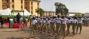 Megwa acknowledging corps members during match past on Thursday at NYSC Iyana Ipaja orientation camp