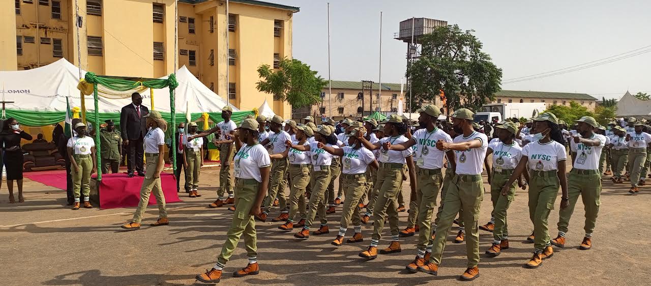 Megwa acknowledging corps members during match past on Thursday at NYSC Iyana Ipaja orientation camp