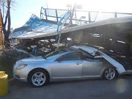 2 injured, vehicles affected as rainstorm pulled down billboard 