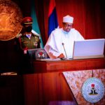 Buhari-signs-the-document-at-the-State-House-Abuja