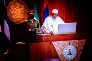 Buhari-signs-the-document-at-the-State-House-Abuja