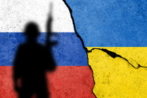 Flag of Russia and Ukraine painted on a concrete wall. Relations