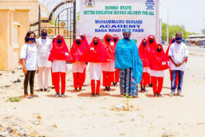 Headmistress, Muhammadu Buhari Academy, Maiduguri,  Hajia Amina Mustapha Haruna and students, welcome Jose Foundation UK Team for COVID-19 Global Sensitisation Campaign to the school