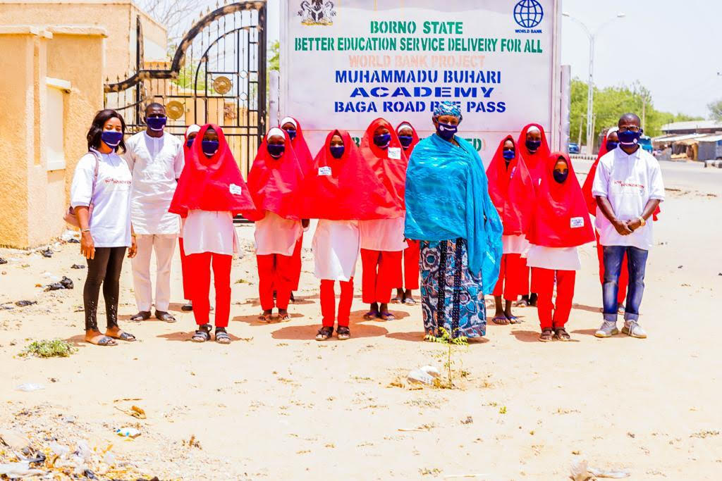 Headmistress, Muhammadu Buhari Academy, Maiduguri,  Hajia Amina Mustapha Haruna and students, welcome Jose Foundation UK Team for COVID-19 Global Sensitisation Campaign to the school