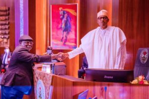 Justice Olukayode Ariwoola (L), President Muhammadu Buhari (R)