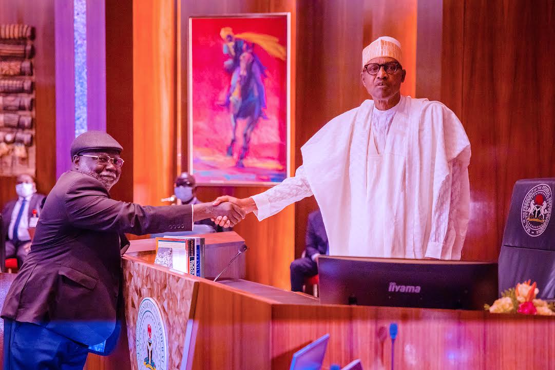 Justice Olukayode Ariwoola (L), President Muhammadu Buhari (R)